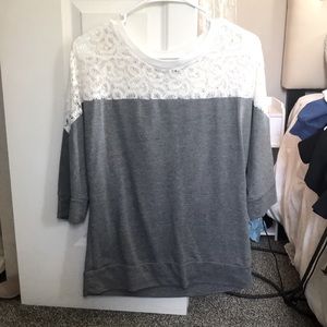 half sleeved shirt. see through design at top. gray on bottom. size small. Ana